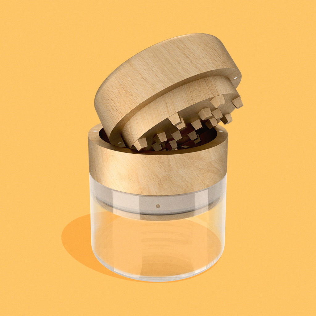 Wood & glass grinder in Beech finish on yellow background